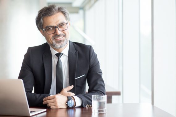 cheerful-businessman-eyeglasses-office